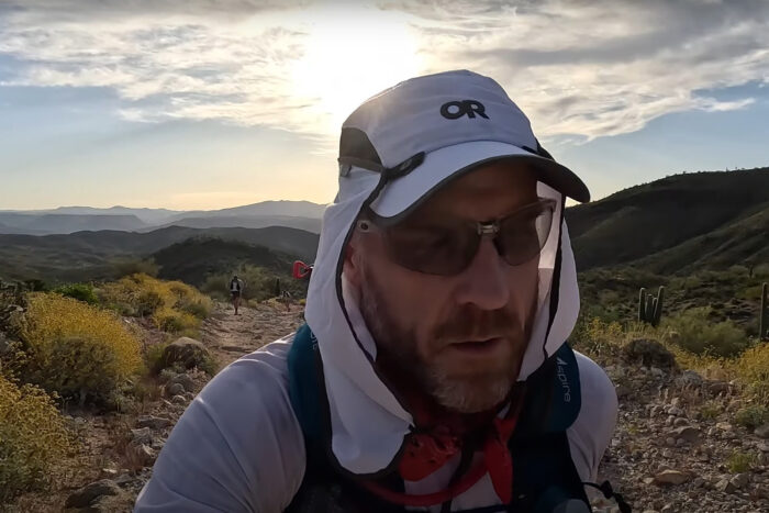 a man runs through the desert of Arizona