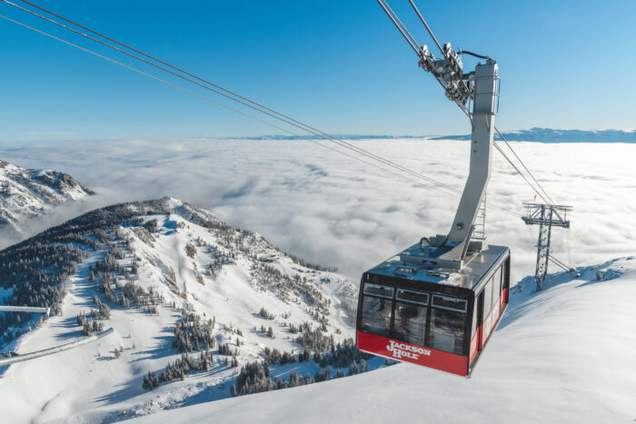 a tram ascends above a mountain
