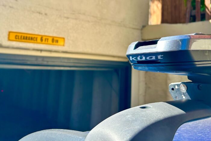 a view of a low-clearance garage door next to a car roofrack