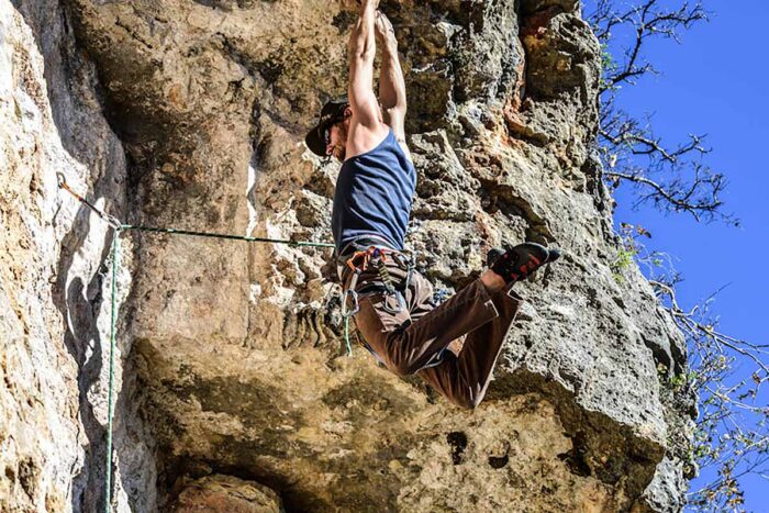 A sport climber takes a fall on a rope