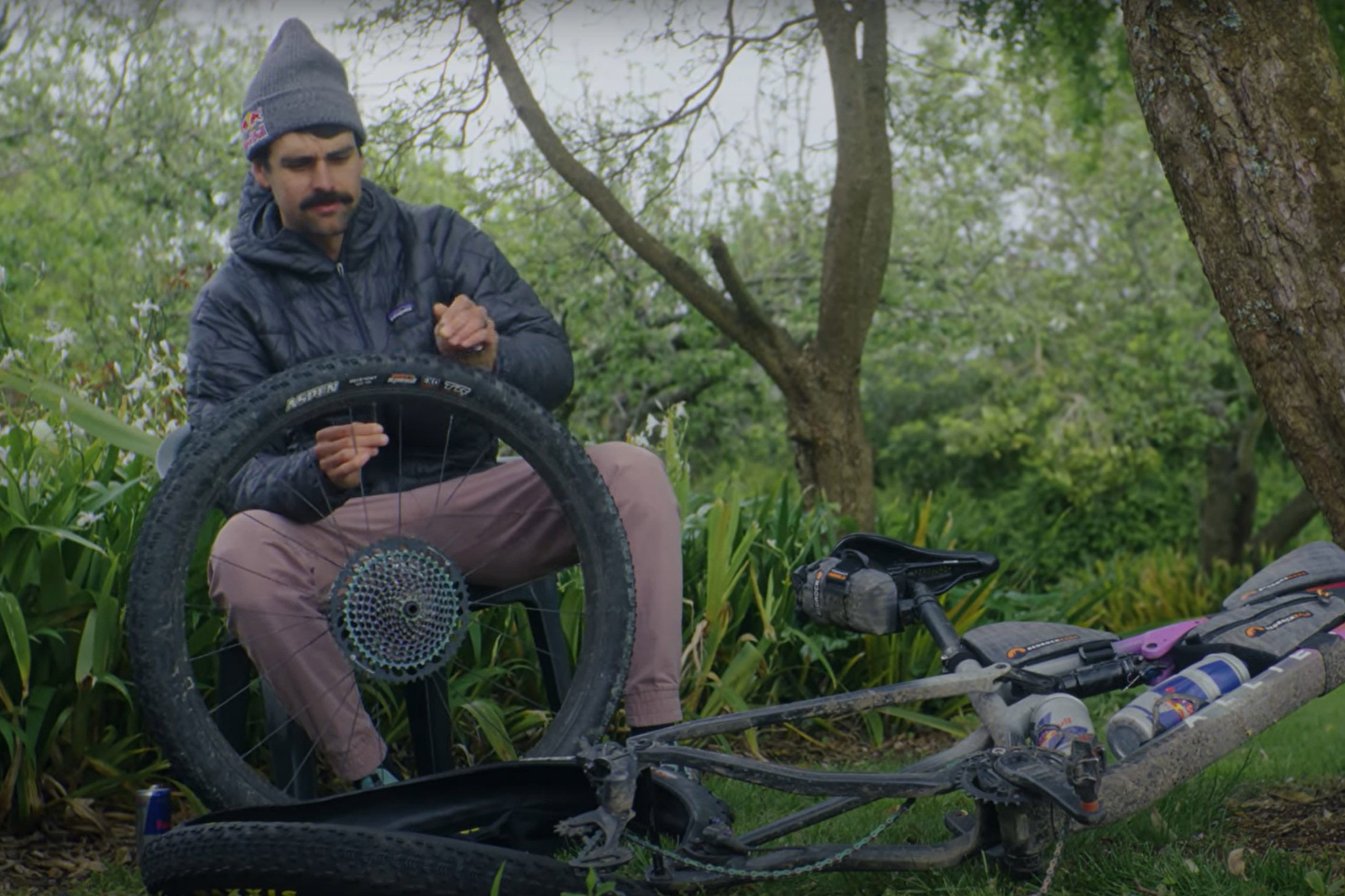 Payson McElveen repairs a tire