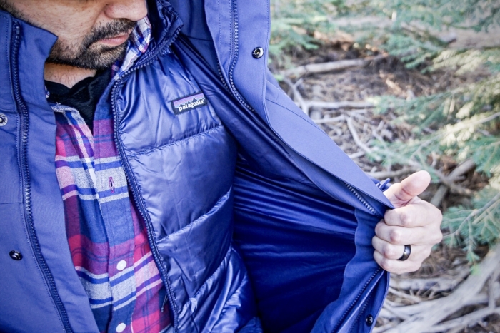 A man demonstrates the inner liner jacket of the Patagonia Tres 3-in-1 Parka.