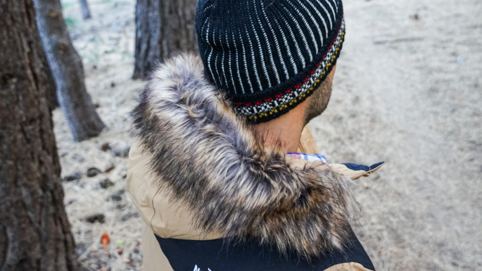 A man demonstrates the large hood on The North Face McMurdo Down Parka.