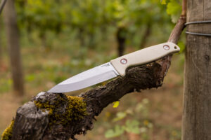 leatherman harvest fixed blade knife on branch outside
