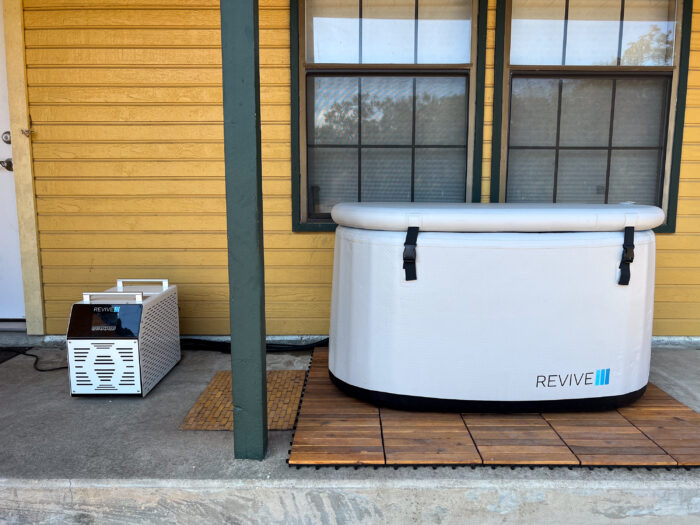 The Revive Inflatable Cold Plunge Tub and Chiller on a back porch