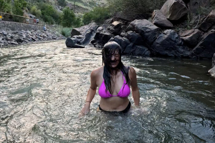 woman in pink swimsut in cold creek, colorado