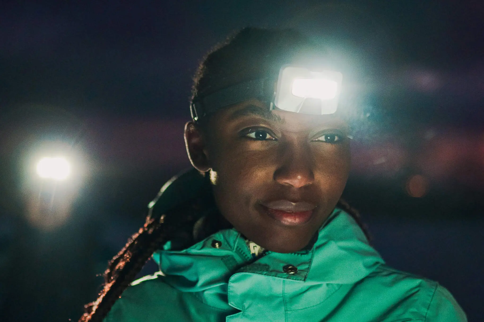 Woman wears Ledlenser HF8R headlamp