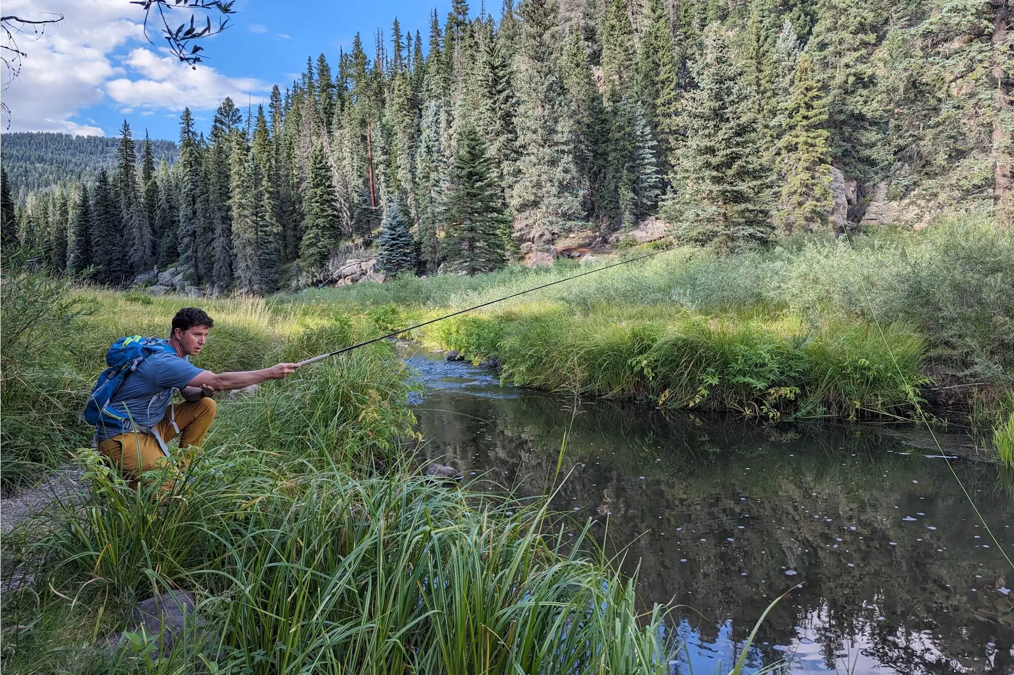 Man fishing a small stream with the Teton Zoom Tenkara Rod