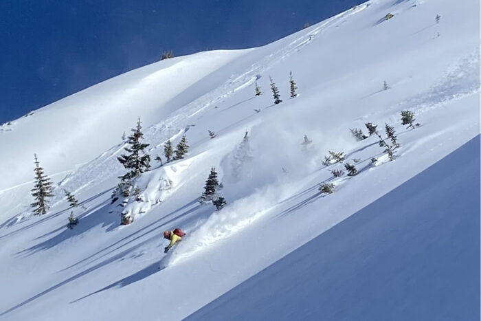 Skier going down a slope
