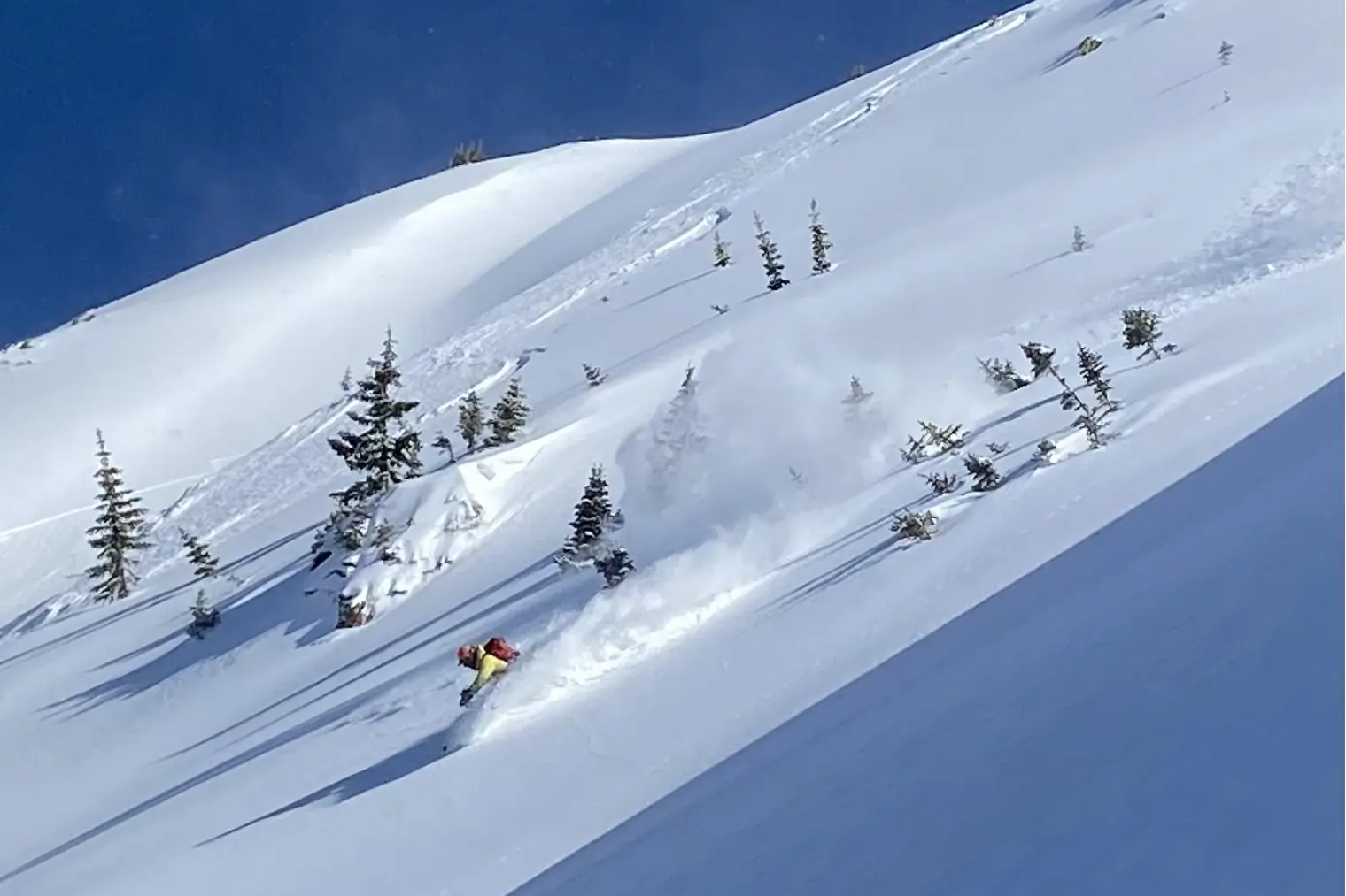 Skier going down a slope