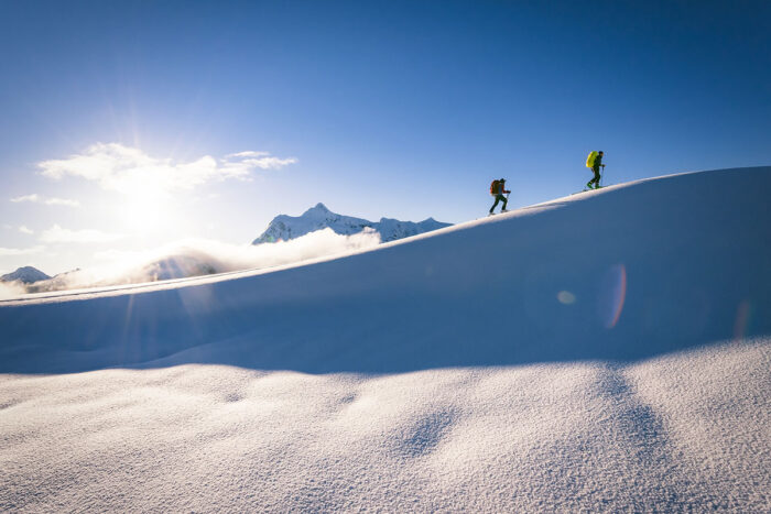 climbing team going up a snowy mountain