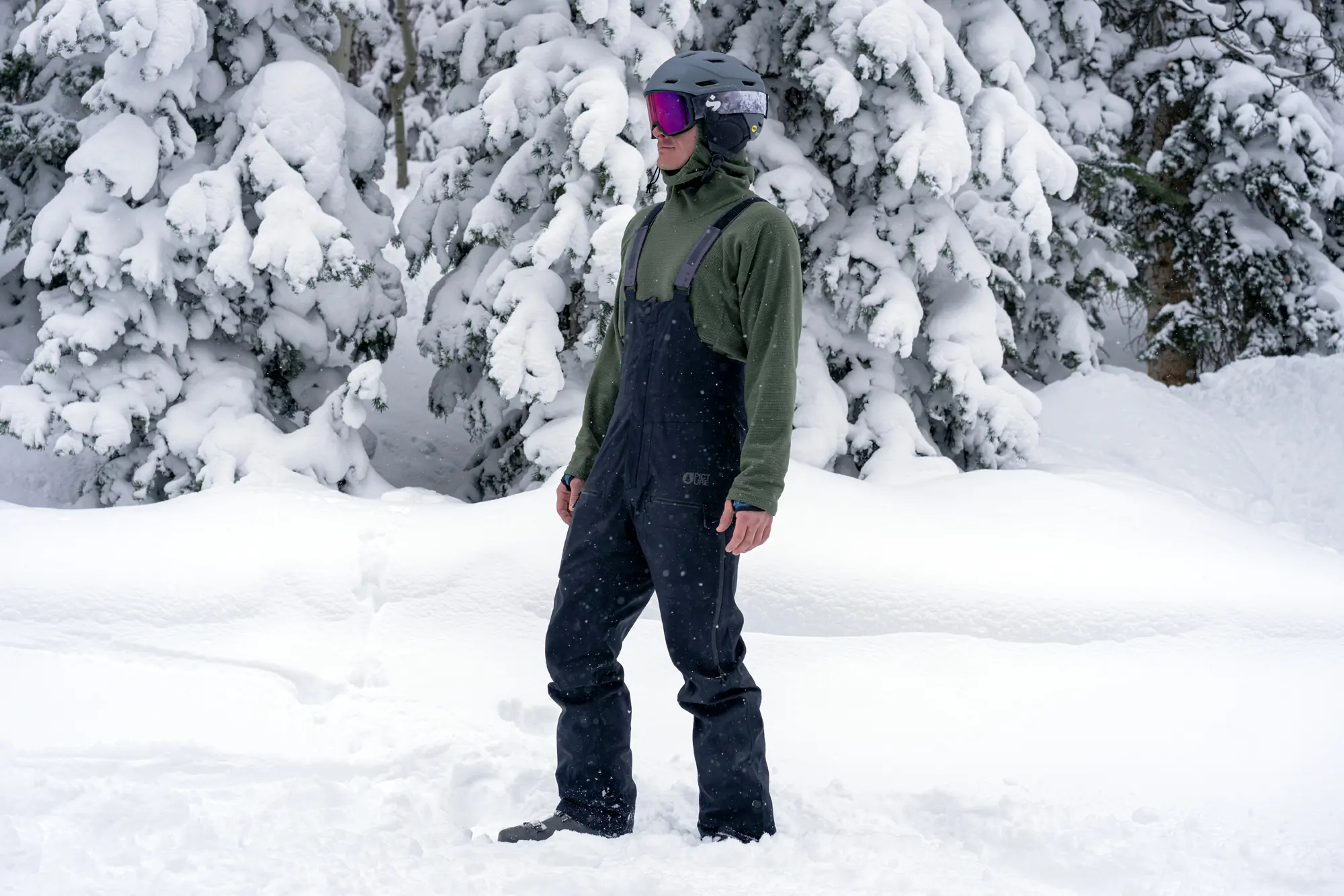 skier posing with men's ski bibs on 