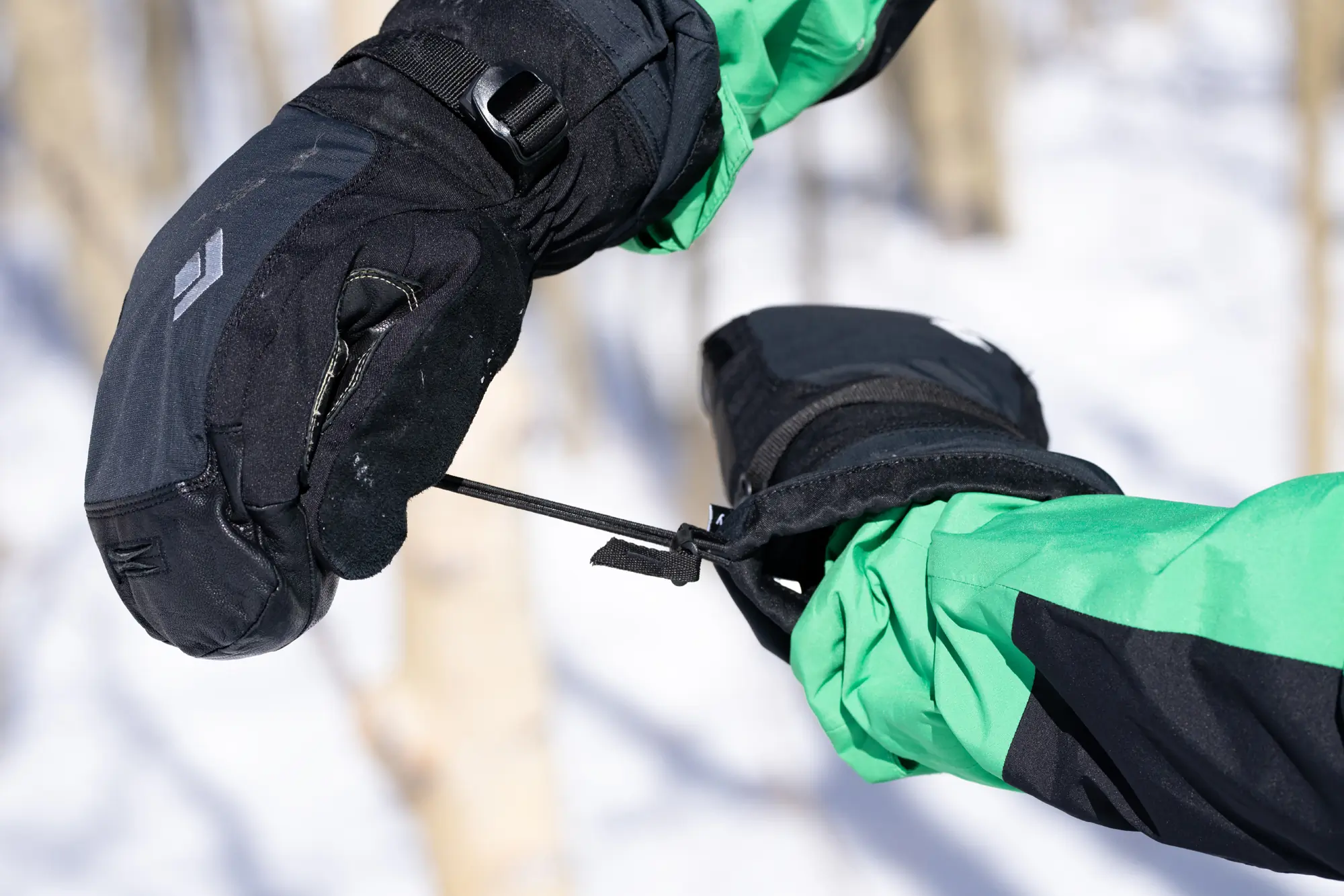 pulling a cuff closes on a winter mitten 