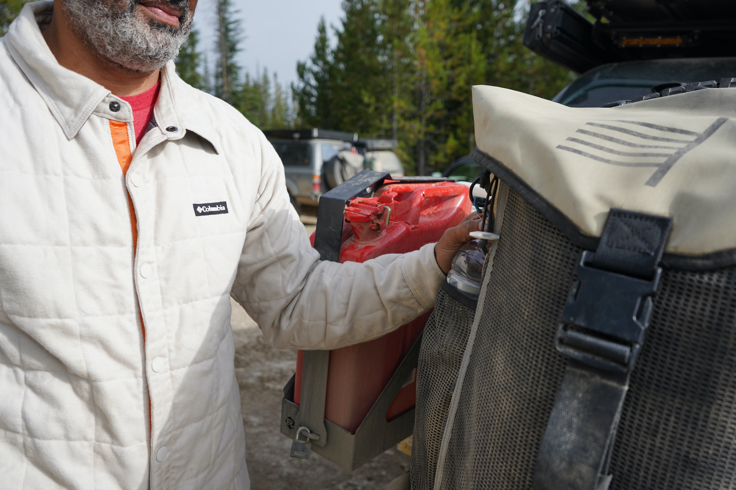 A member of Veteran Overland checks his rig.