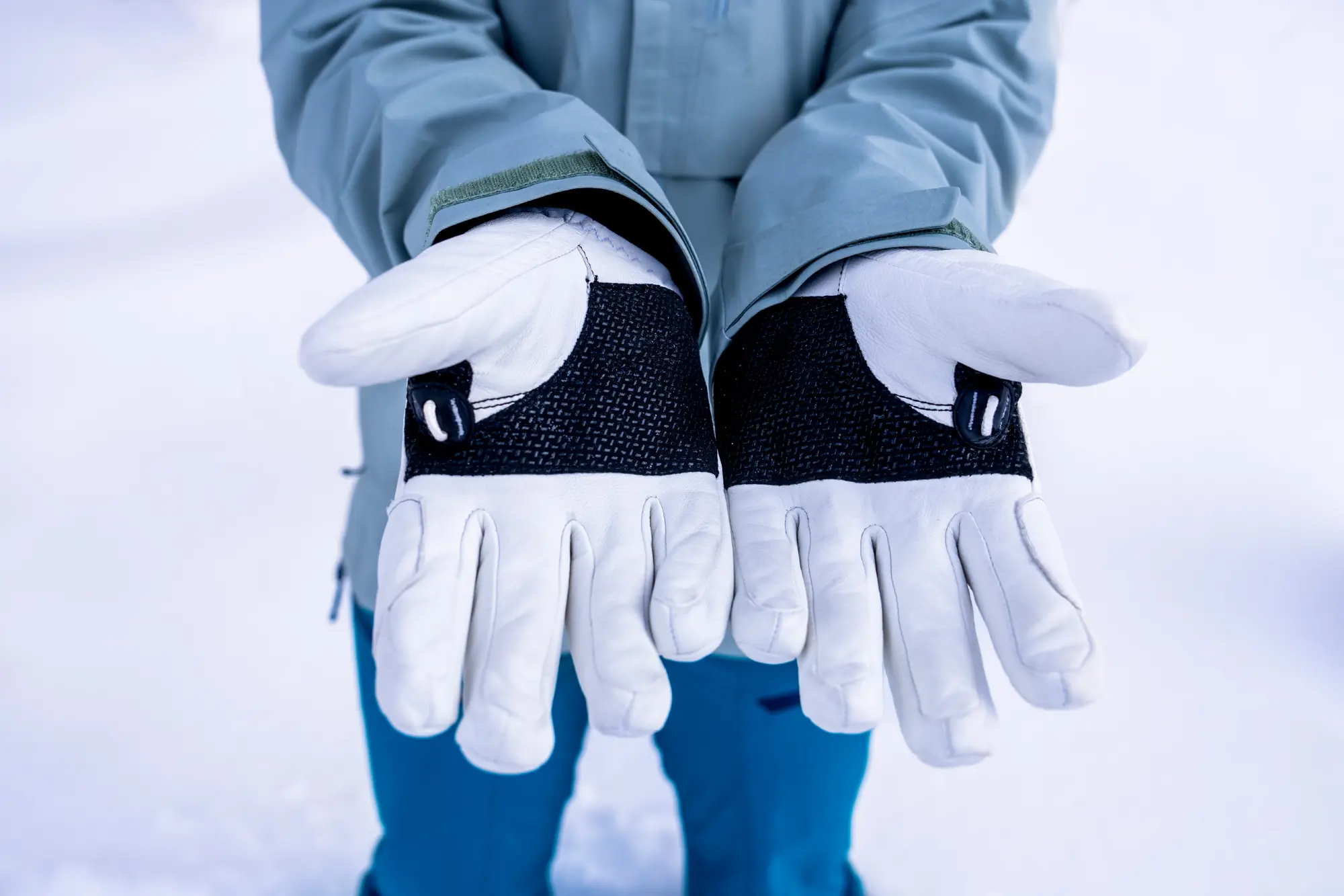 woman holding palms open while testing ski gloves 