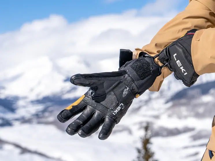 skier using pull loop on the wrist of LEKI ski gloves 