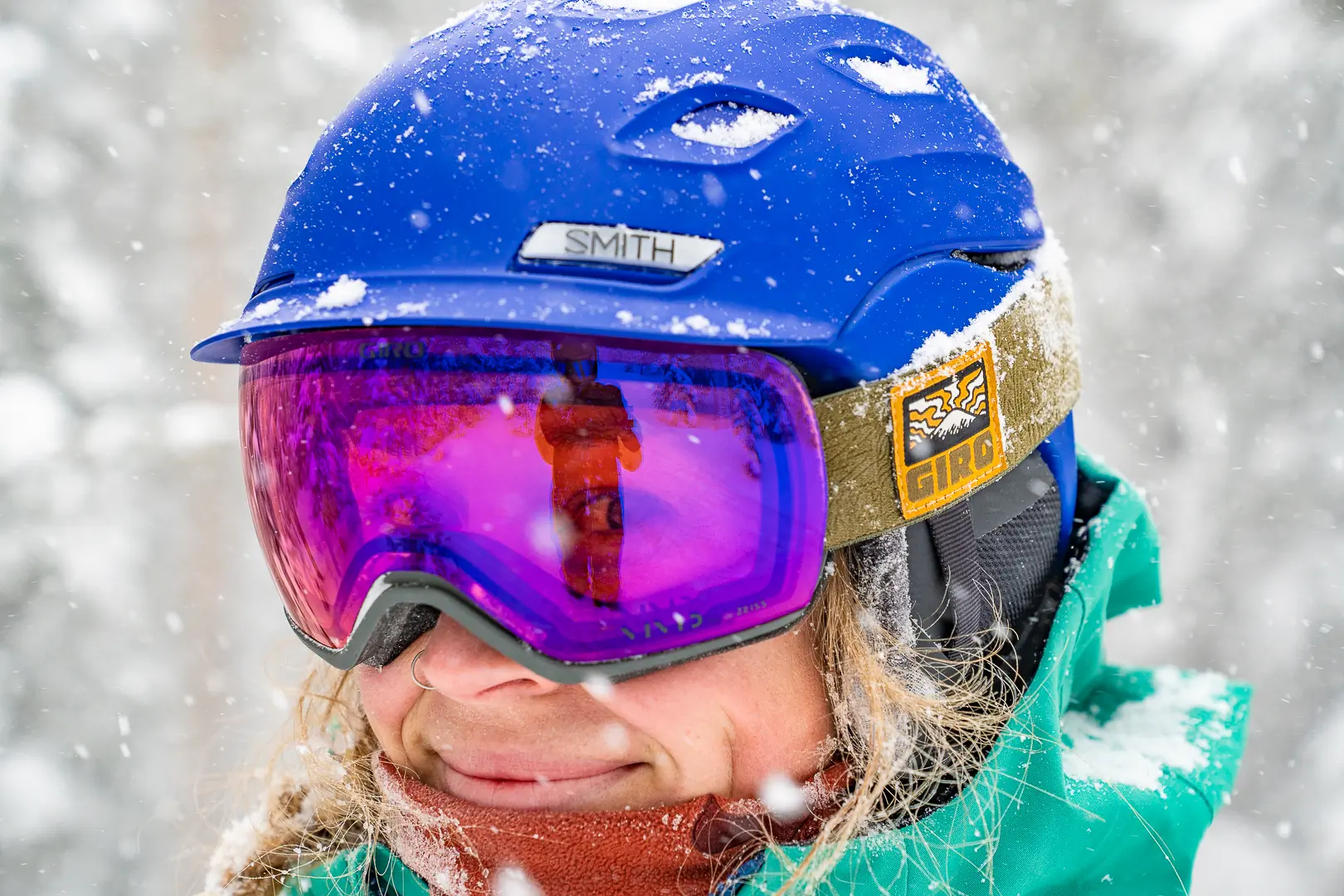 portrait of snow falling and woman looking through low light lens on snow goggles