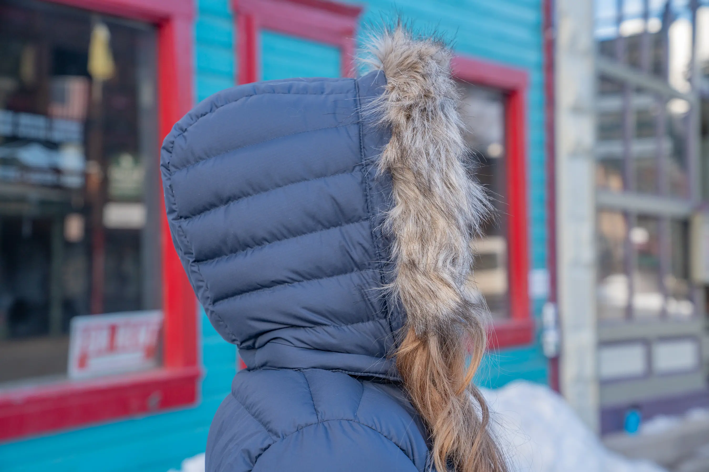 side profile of the hood with faux fur on the Rab Women’s Deep Cover Down Parka