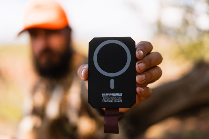 Hunter holding a poseidon nano portable power bank