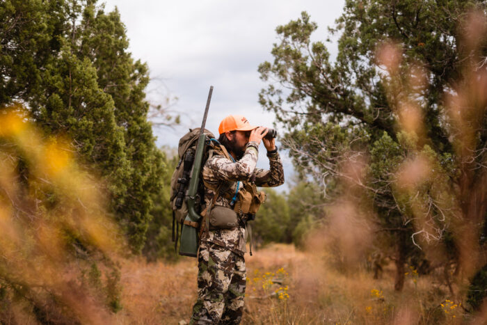 Author wearing full hunting gear and sling on a hunting trip