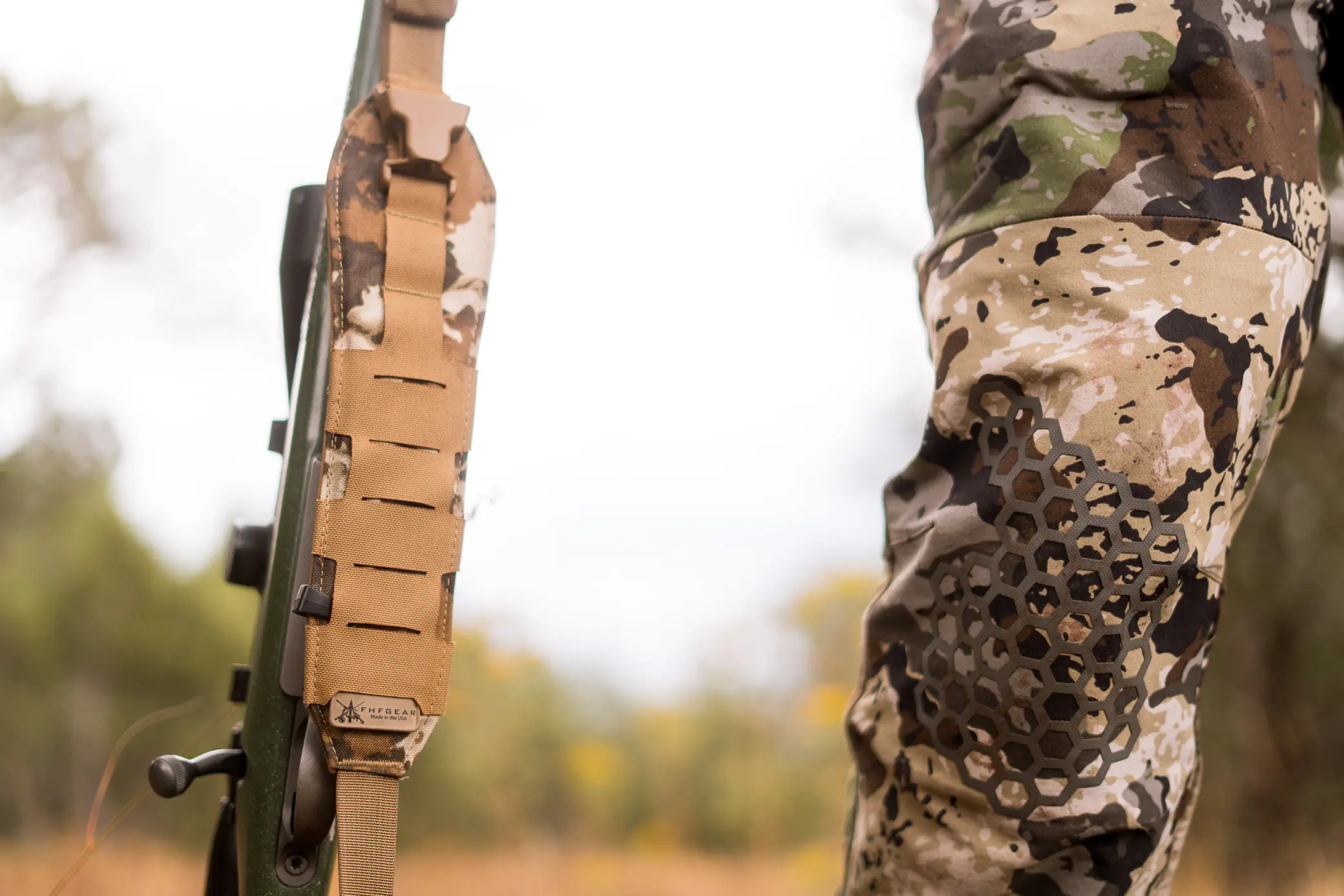 Hunter standing next to his rifle with FHF sling