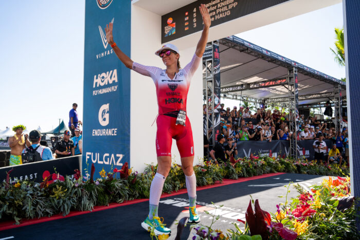 IRONMAN runner Daniela Ryf finishing a race and waving to fans