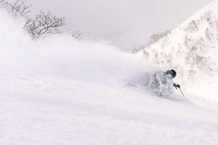 Skiing guide enjoying the perks of setting the skintrack