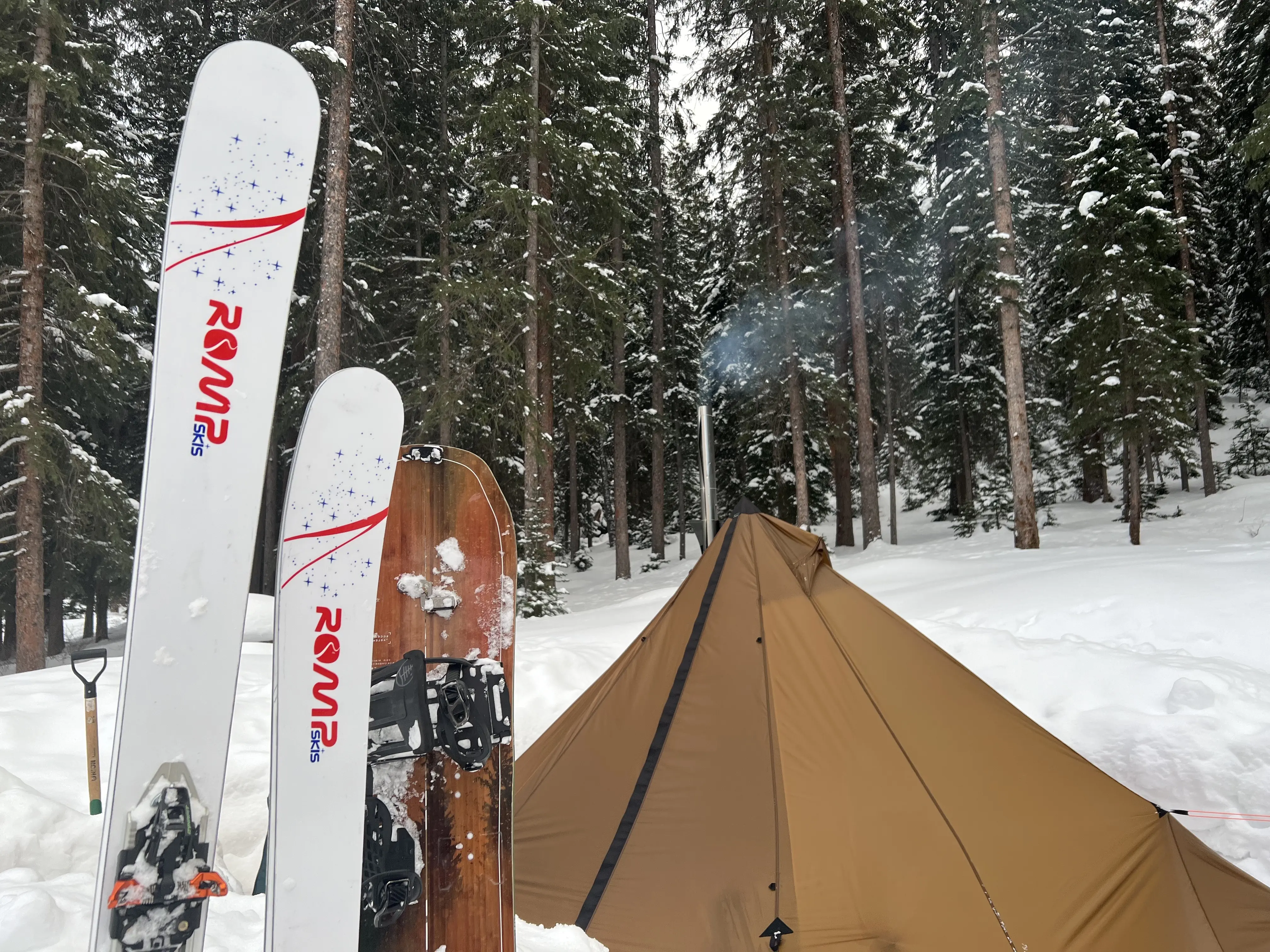 Tent and skis in snow