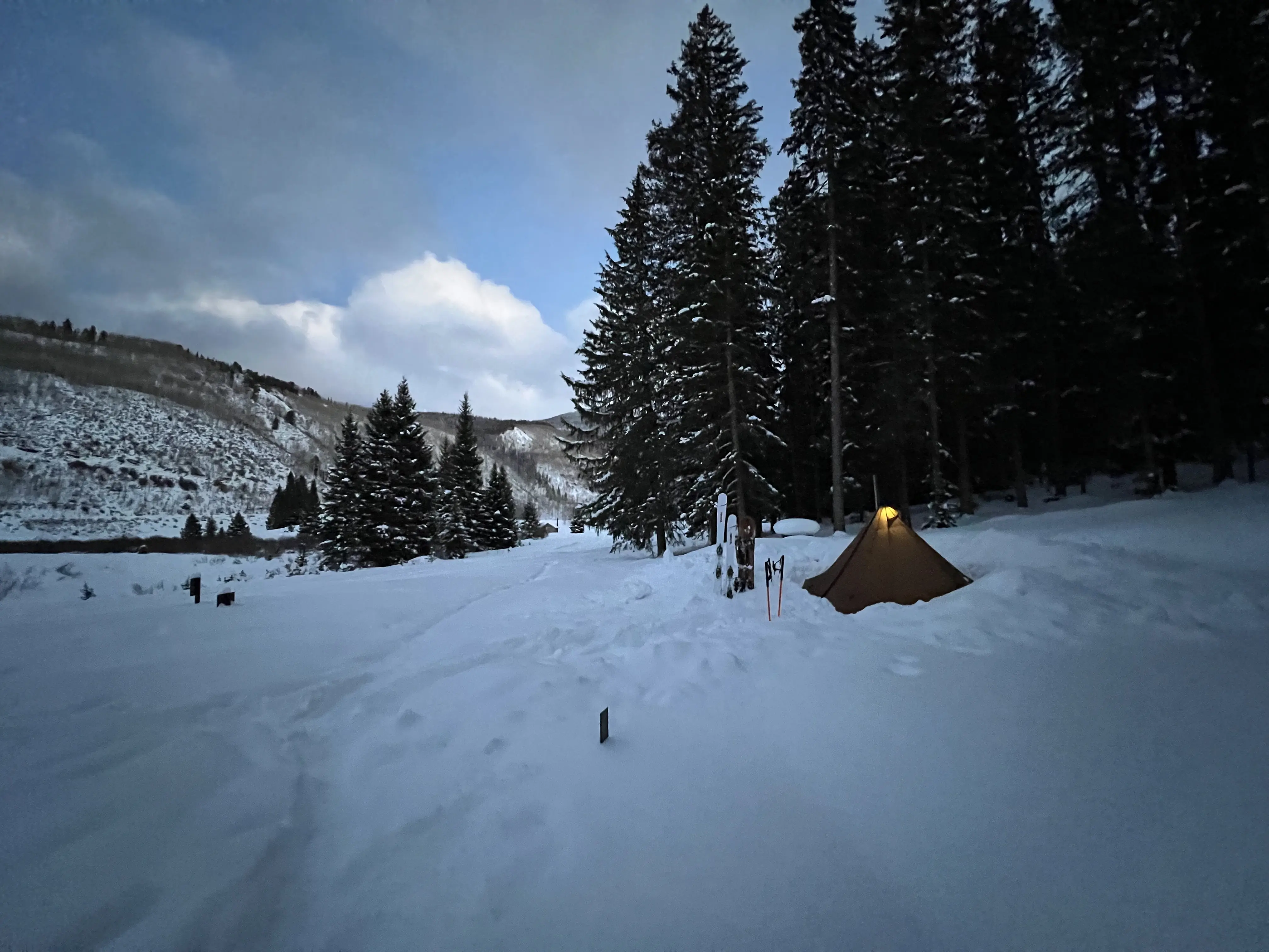 Seek Outside Redcliff tent in snow at dusk