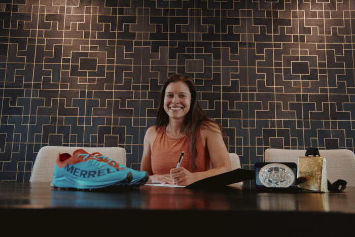 Merrell's GET FKT - Women's Competition co-winner Sara Aranda signing her contract;