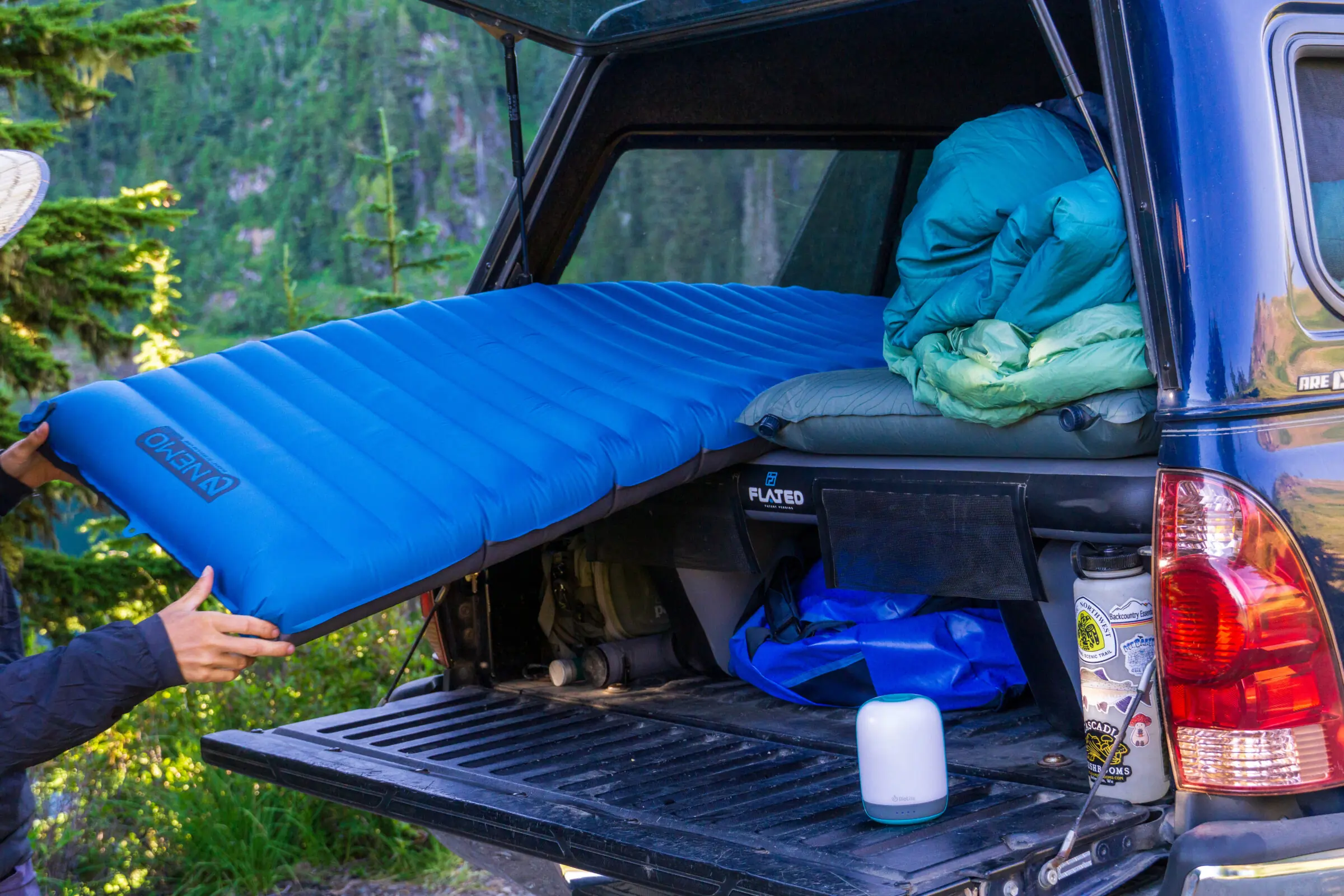 From car-camping tents to the back of the pickup, we've tossed camping mattresses pretty much everywhere to give them a good shake-down