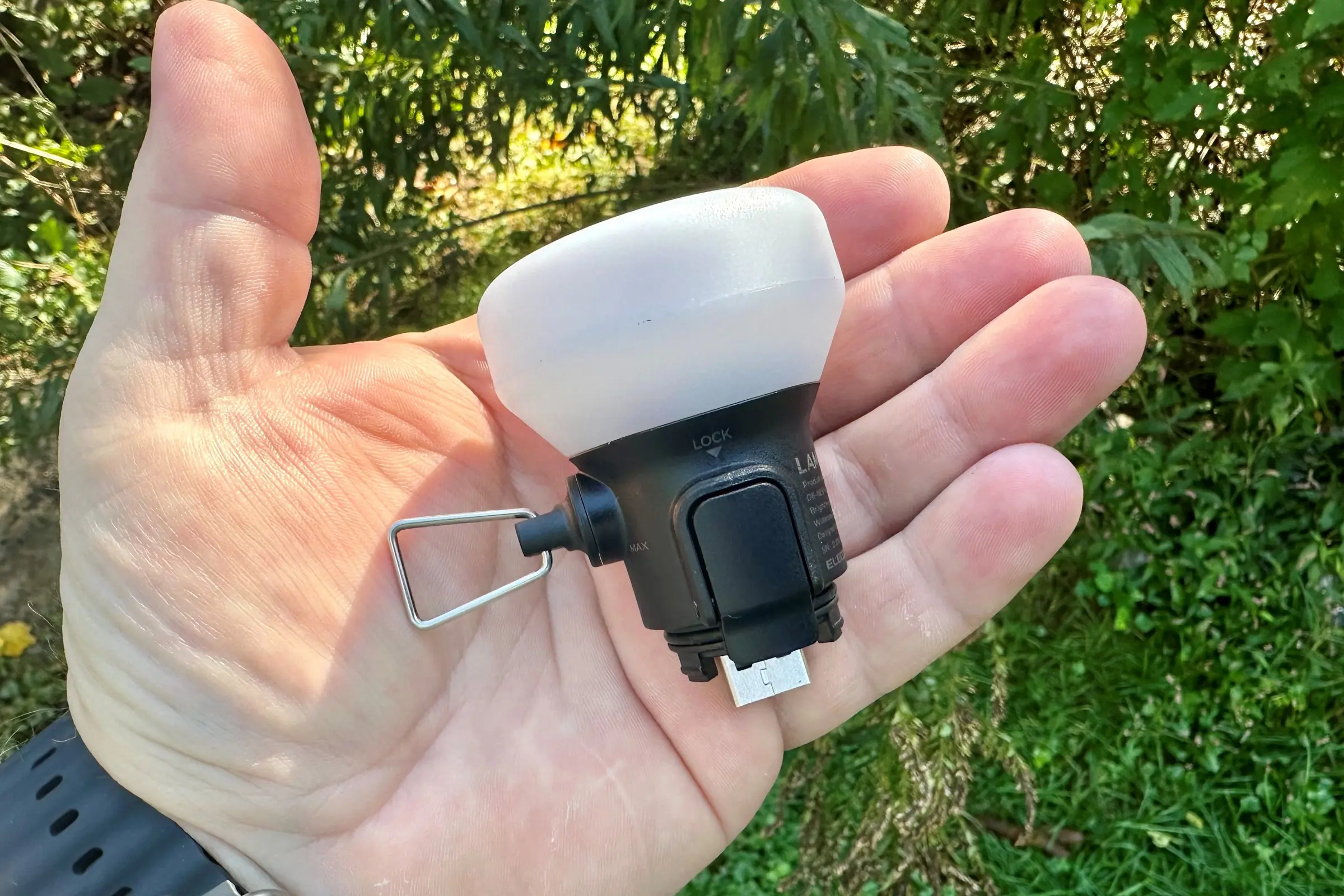 Portable led lamp showcased on a hand