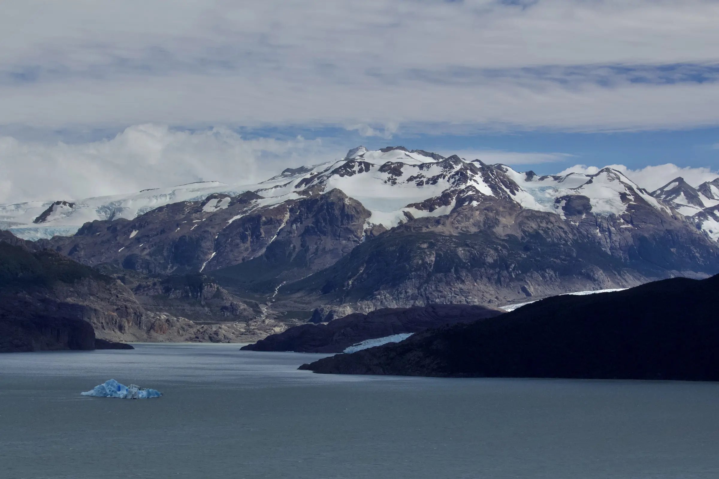 View from the Grey Glacier Lookout Point of the surrounding mountains and glacial pieces floating in Grey Lake.