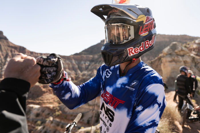 Szymon Godziek fist bumps at Red Bull Rampage in Virgin, Utah, USA on October 12, 2023.