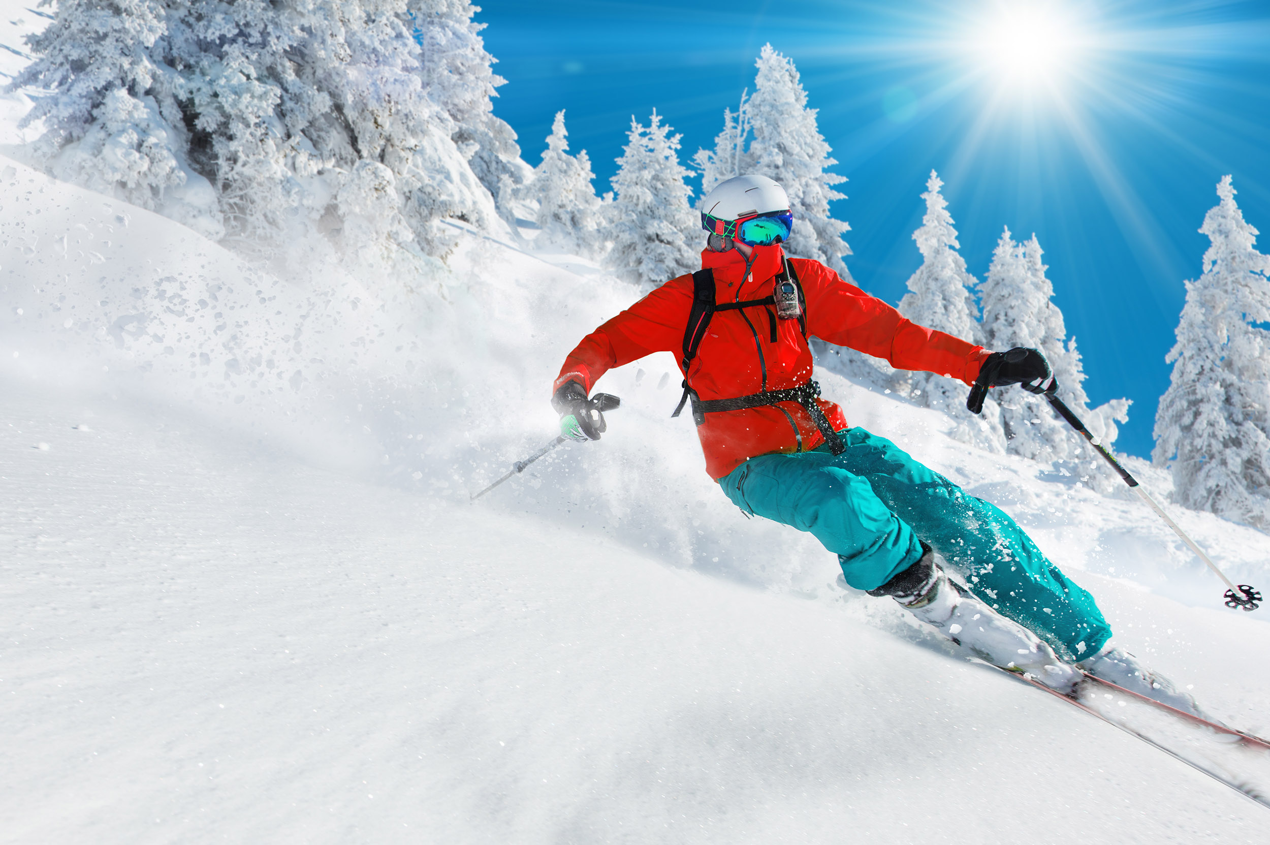 a person leans into a turn while skiing