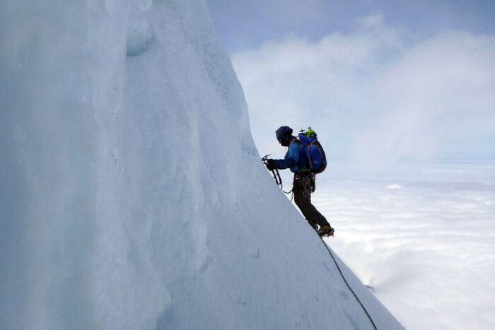 climber with full climbing gear going up the mt baker