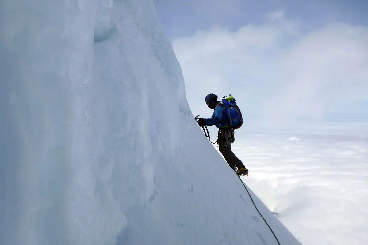 climber with full climbing gear going up the mt baker