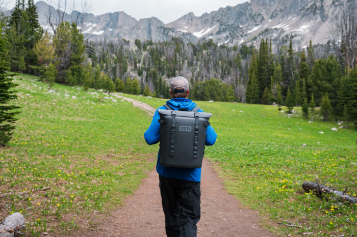 conrad anker hiking mountain trail wearing yeti soft coolers