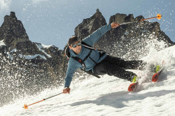 a man skis while wearing Ombraz sunglasses