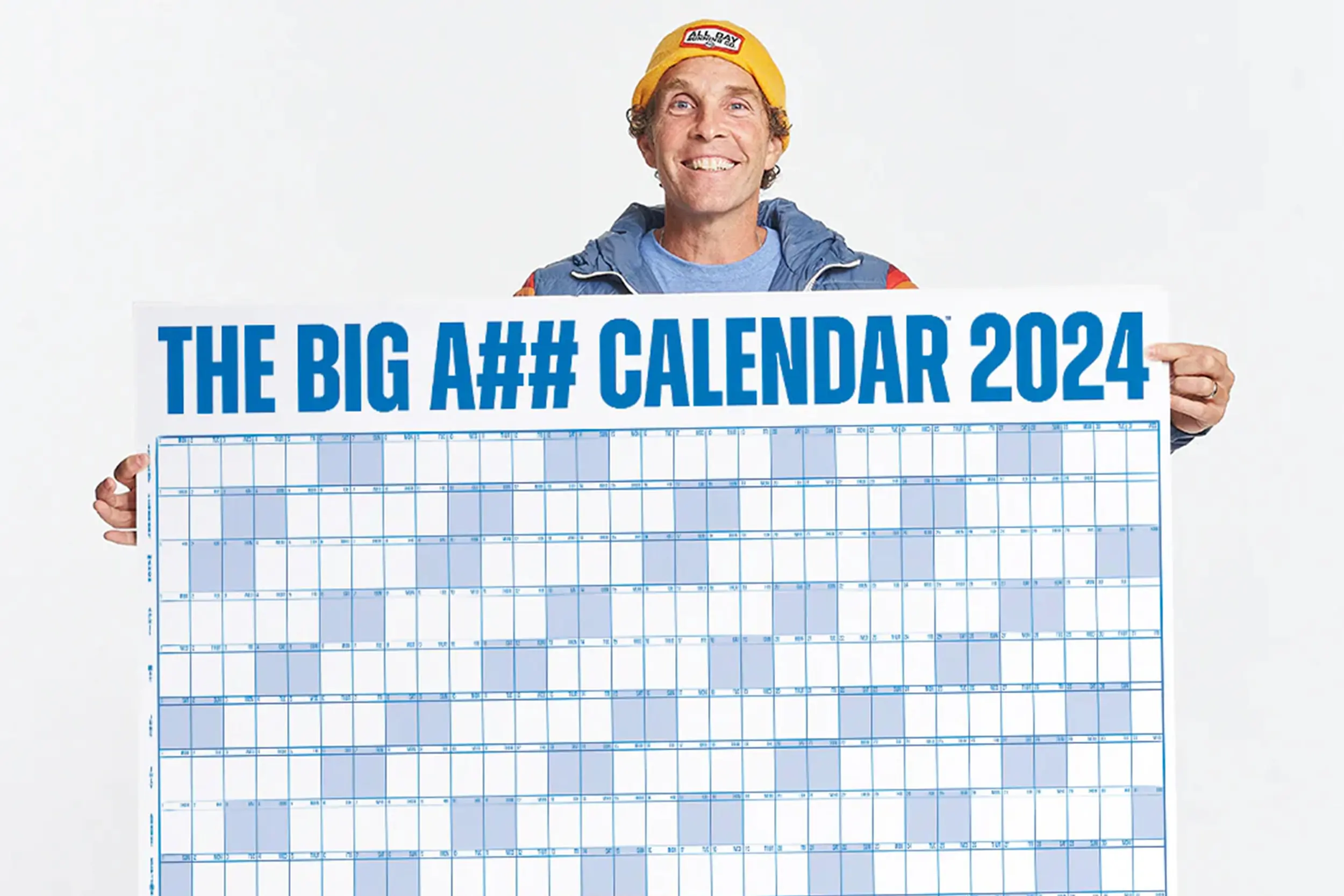 a man holds a big A## calendar between two outstretched hands