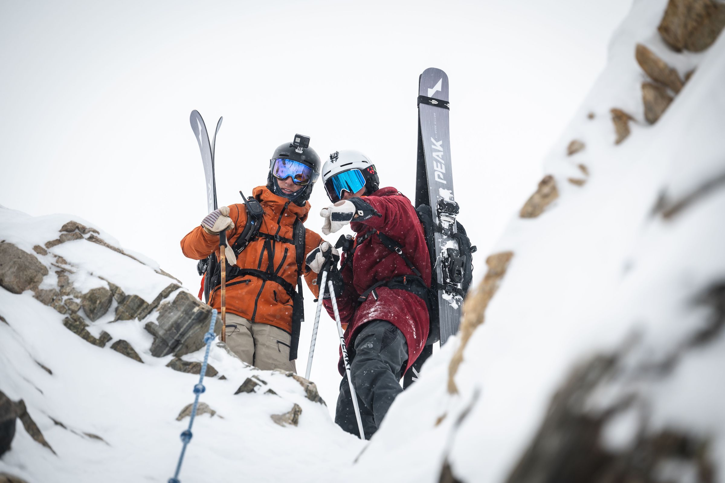 Two skiers scoping out a line.