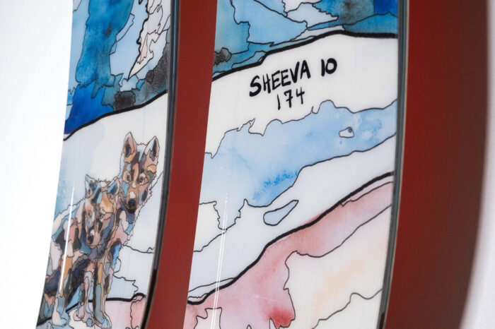 skis with watercolor wolves and a mountain scene