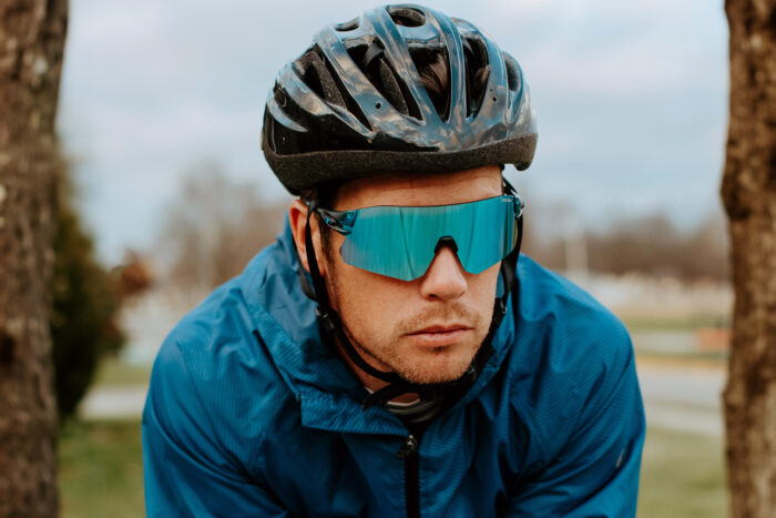 man in bike helmet wearing sunglasses