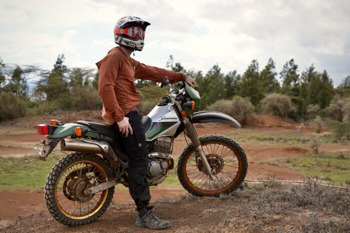 Man on motorcycle in work pants