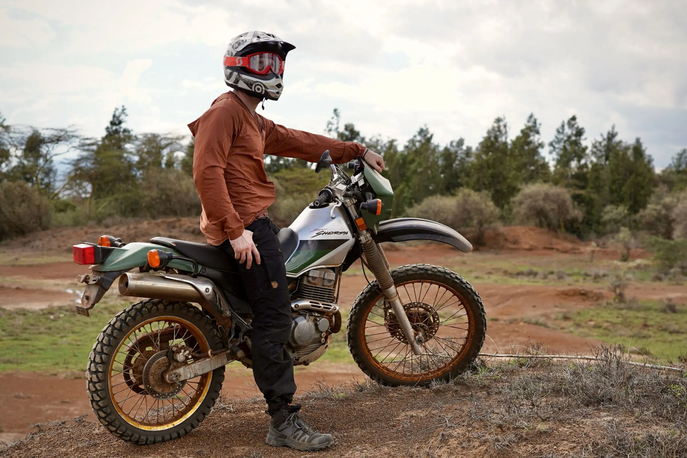Man on motorcycle in work pants