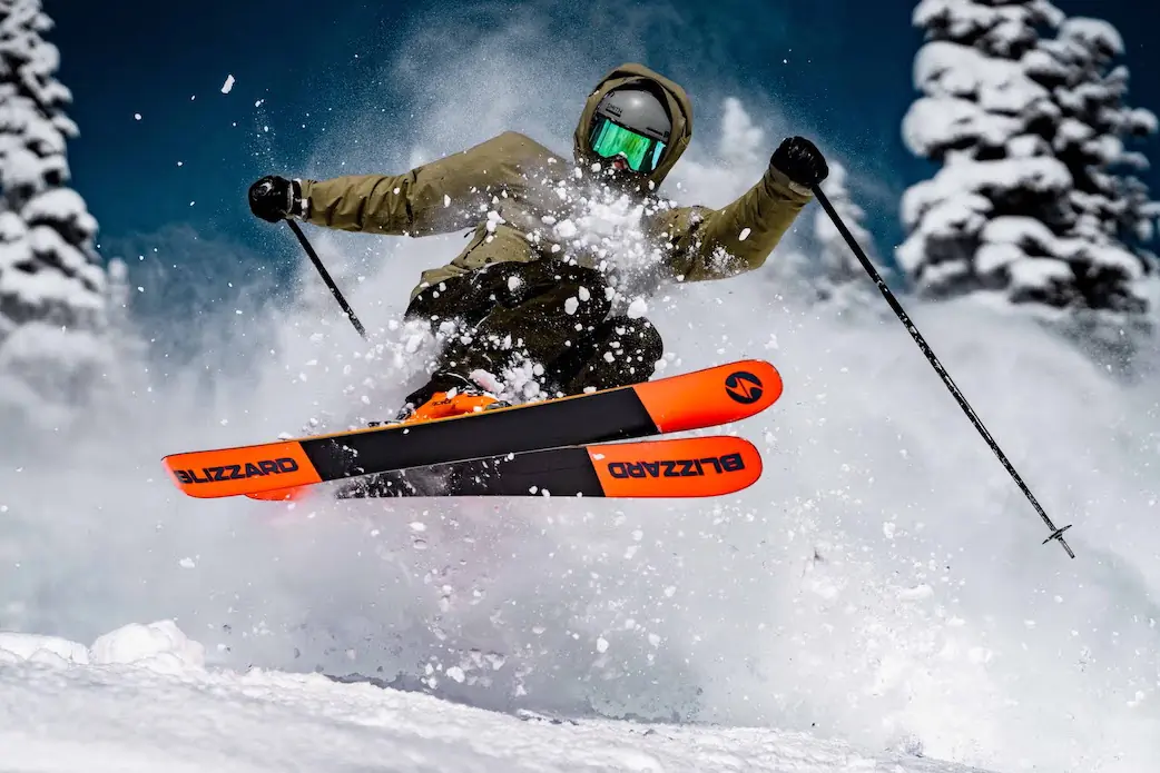 skier jumping on pow