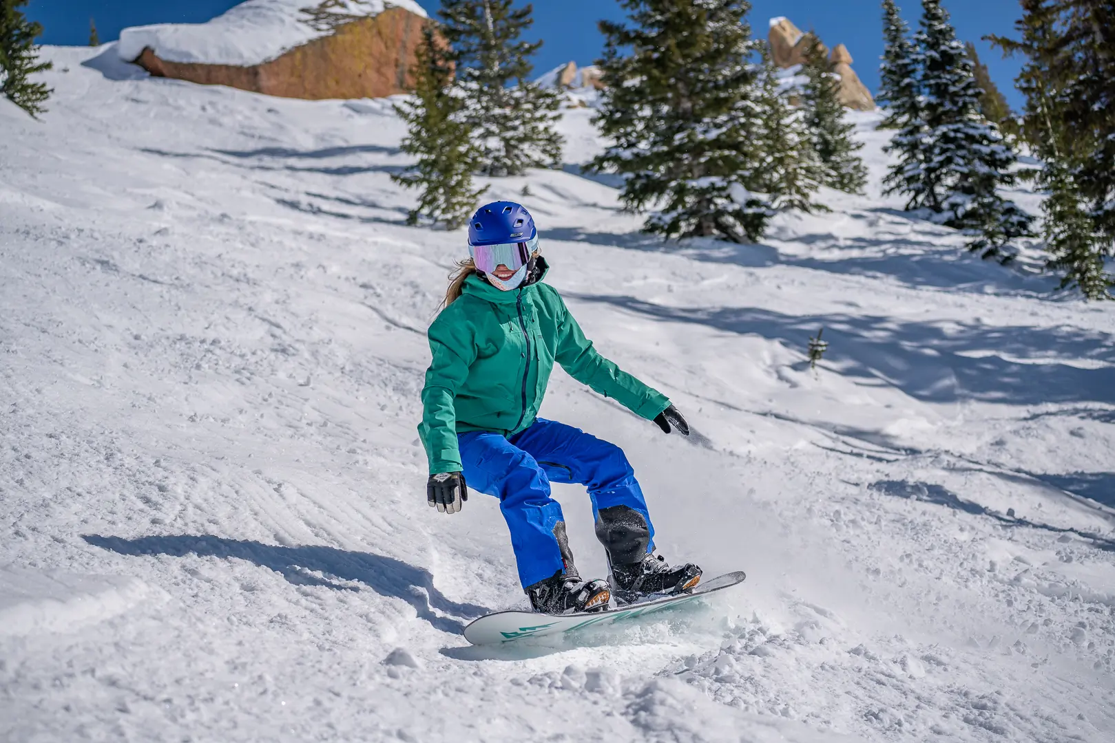 snowboarder taking heel side turn