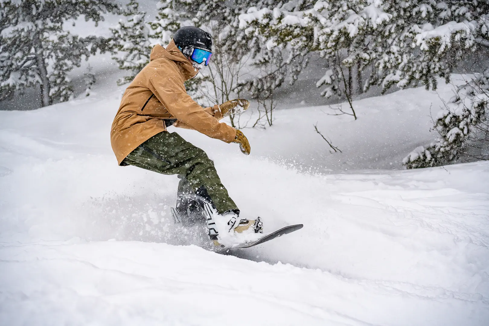 snowboarder floating on pow