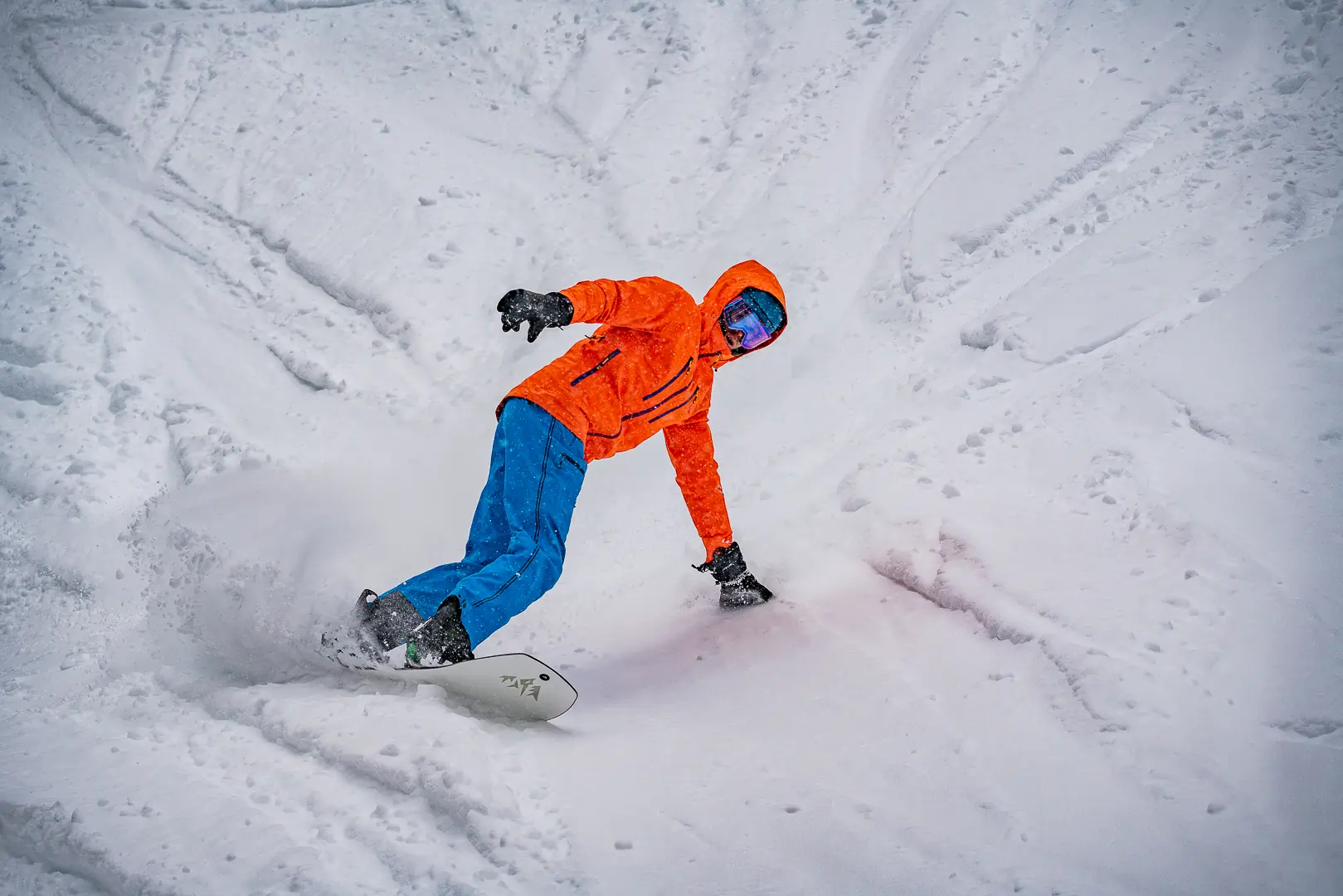 taking toeside mixed-pow turn on floaty powder board 