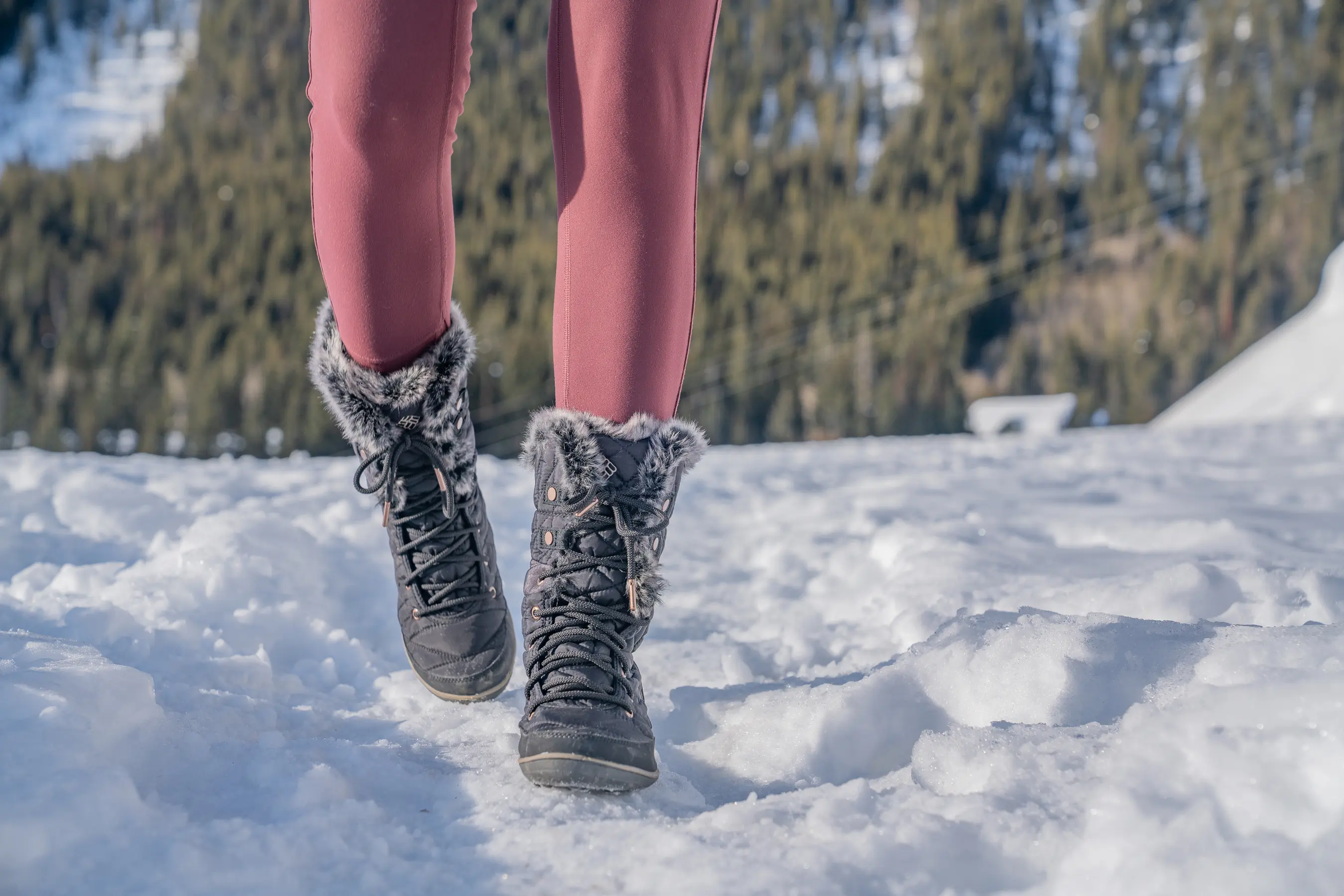 testing tall women's winter boots on snow 